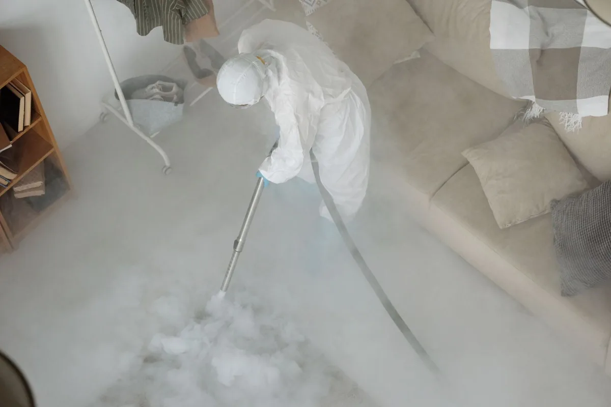 Biohazard cleanup technician in protective equipment, Shullsburg, WI
